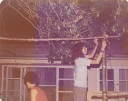 fr dvoram Sukkot on the kibbutz. Dodi and Rueben setting up. 10-8-76.